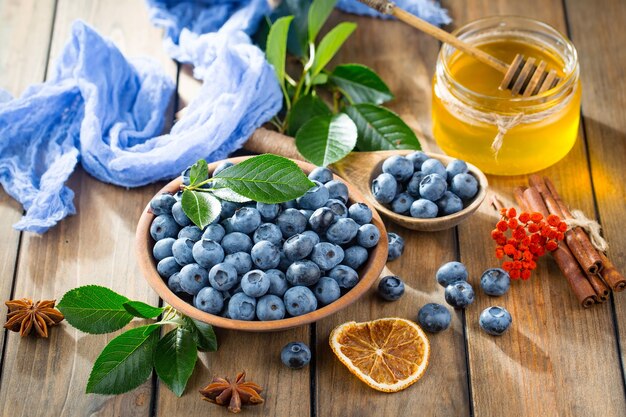 Ripe blueberries, in composition on an old surface.