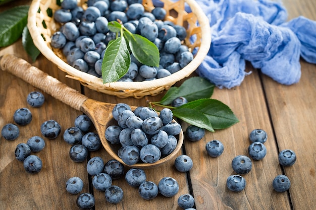 Ripe blueberries, in composition on an old surface.