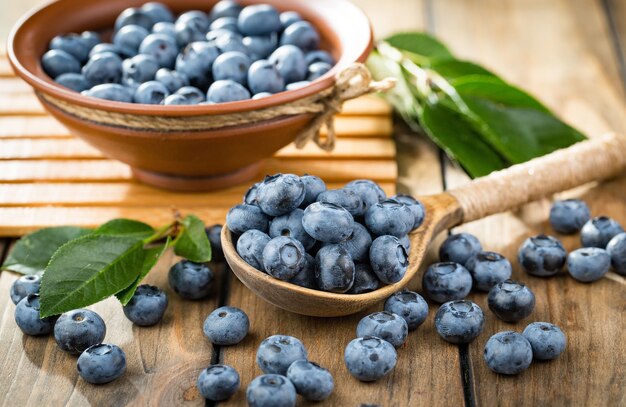 Ripe blueberries, in composition on an old surface.