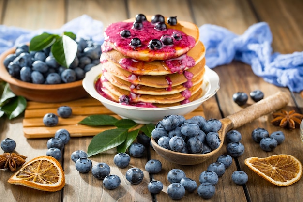 Ripe blueberries, in composition on an old surface.