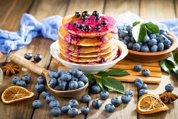 Ripe blueberries, in composition on an old surface.