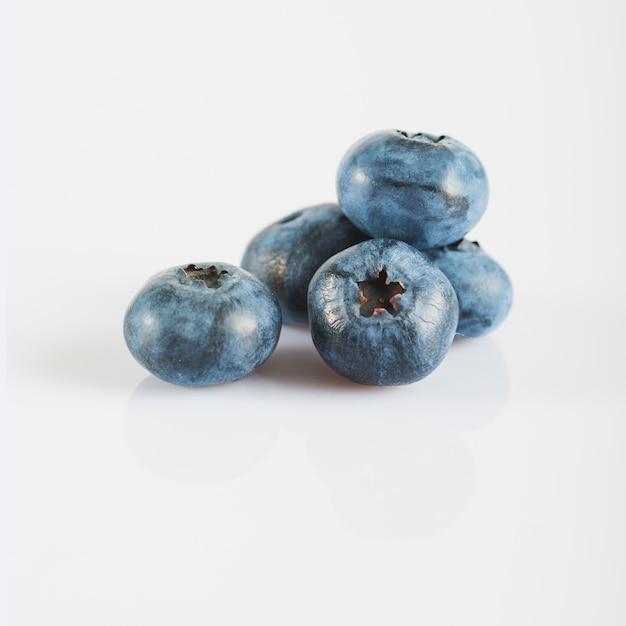 Ripe blueberries on white background