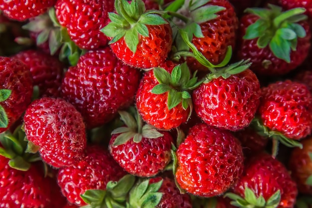 Ripe bright strawberries as a background