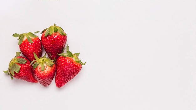 Ripe bright strawberries on white background