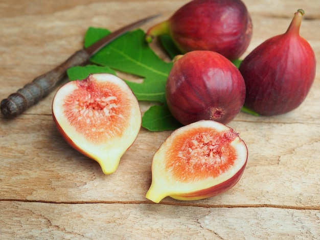 Ripe Brown Turkey fig cut in half on wooden table