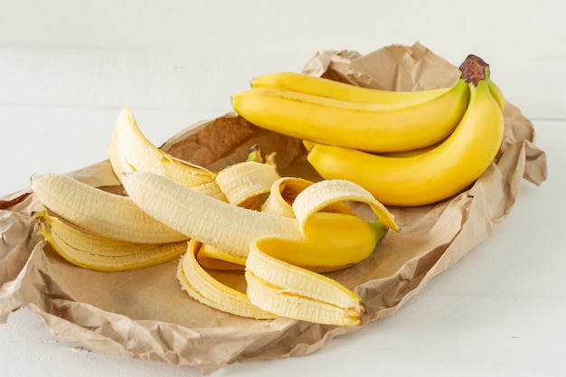 Ripe bunch of bananas in paper bag. Healthy eating concept.