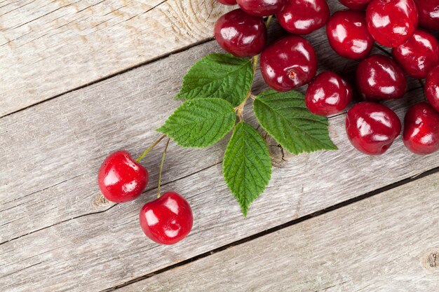 Ripe cherries on wooden table