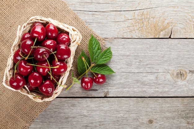 Ripe cherries on wooden table