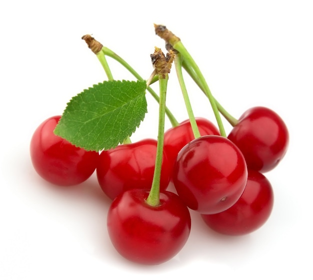 Ripe cherry with leaf isolated on white