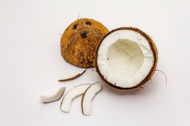 Ripe coconut cut on two half isolated on white background