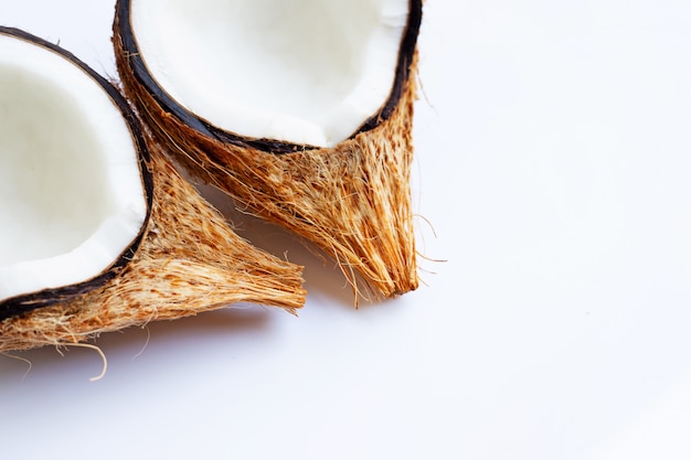 Ripe coconuts on white. Top view of tropical fruit.