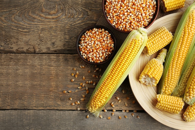 Ripe corn on wooden background