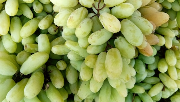 Ripe delicious grapes in the market on the counter