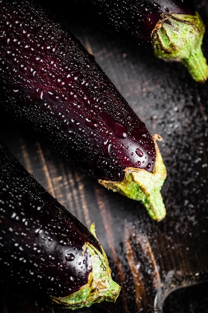 Ripe eggplant with droplets of water