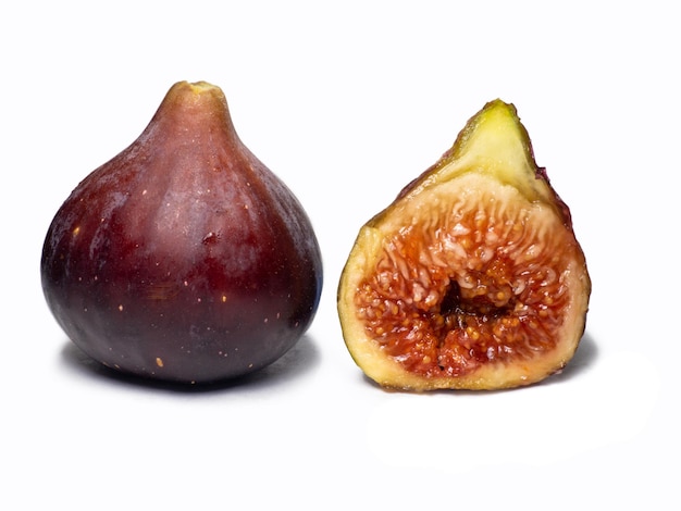 Ripe figs on a white background Southern fruit isolate Sliced purple fruit Healthy diet