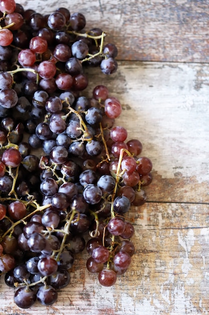 Ripe fresh grapes on a wooden table