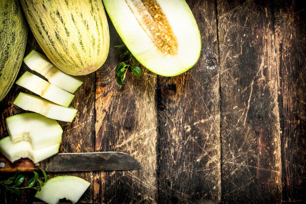 Ripe fresh melon on wooden table