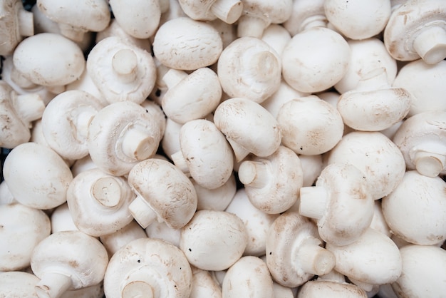 Ripe fresh mushrooms in a box in the warehouse after assembling a close-up.