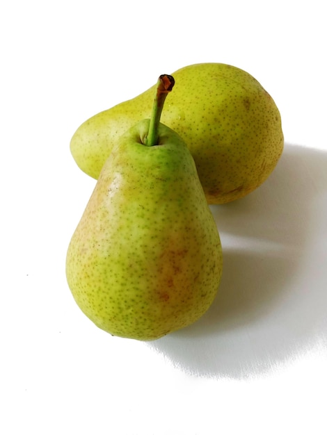 ripe fresh pears on white background