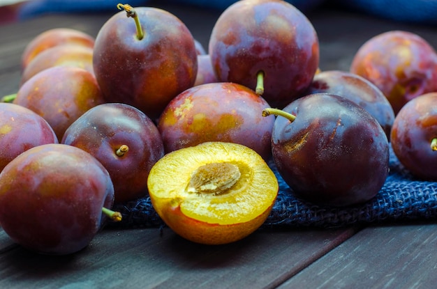 ripe fresh plums on a close-up table