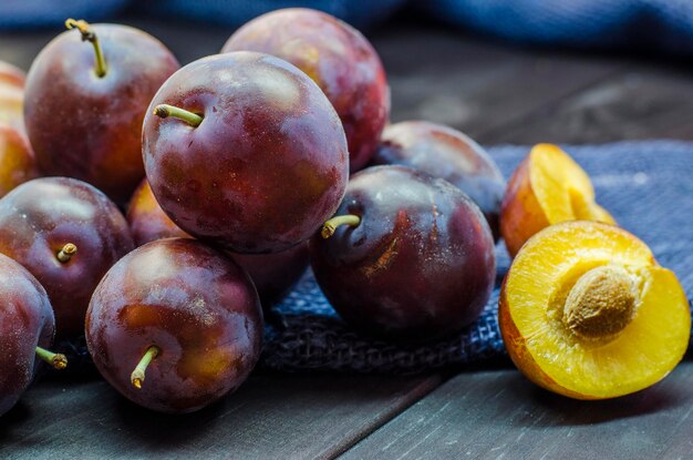 ripe fresh plums on a close-up table