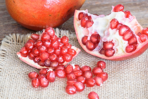 Ripe fresh pomegranate  on a wooden table.