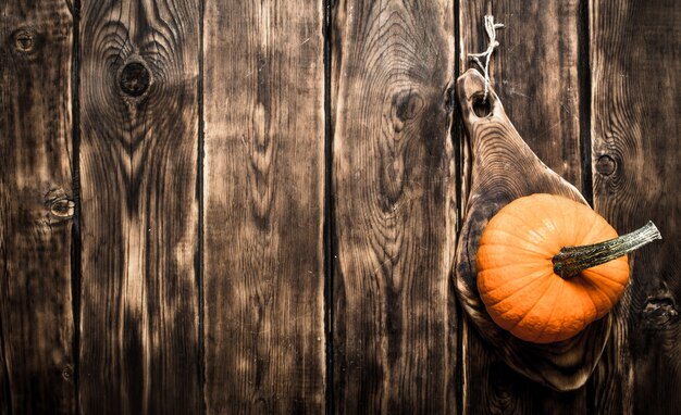 Ripe fresh pumpkin. On a wooden table