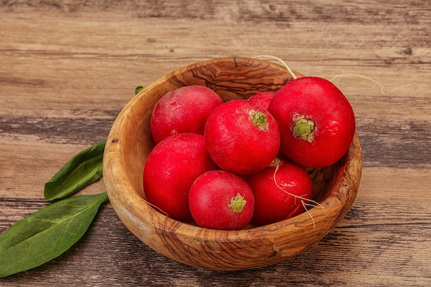 Ripe fresh radish heap over wooden