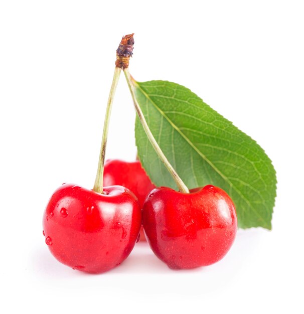 Ripe fresh red cherry isolated on white surface