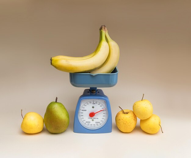 Ripe fruits and kitchen scales