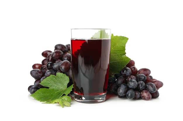 Ripe grape and glass of juice isolated on white