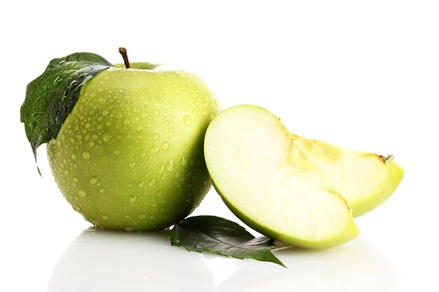 Ripe green apple with leaf and slice isolated on white