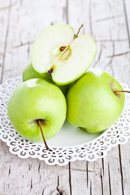 Ripe green apples in a plate 