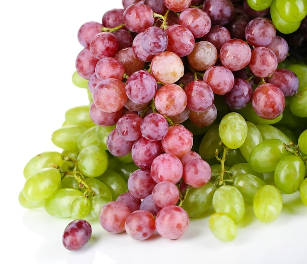 Ripe green and purple grapes isolated on white