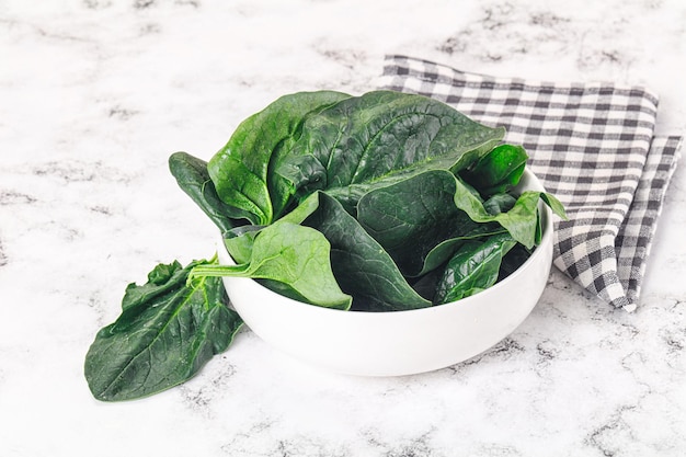 Ripe green spinach leaves heap