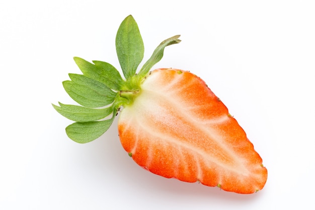 Ripe half strawberry isolated on white.