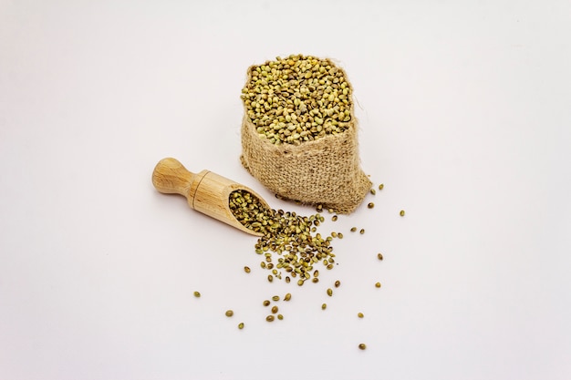 Ripe hemp seeds isolated on white background