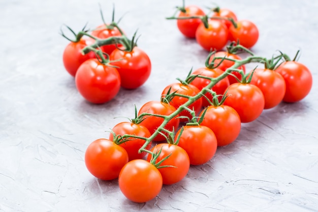 Ripe honey cherry tomatoes on a branch