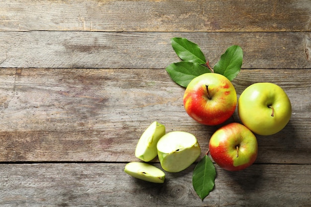 Ripe juicy apples on wooden table