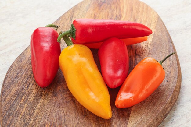 Ripe juicy baby various color bell peppers heap