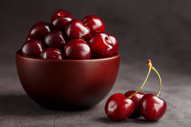 Ripe and juicy cherry berries on black 