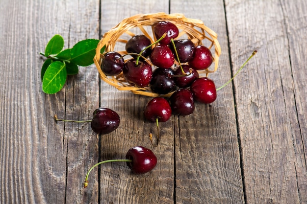 Ripe juicy cherry on a wooden table
