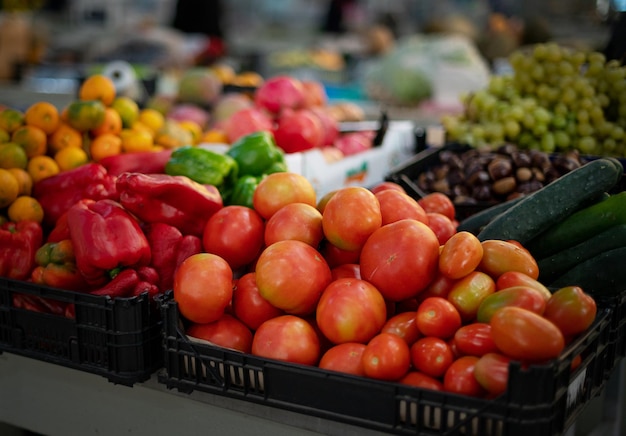 Ripe juicy farm fresh red peppers and tomatoes on farmer market