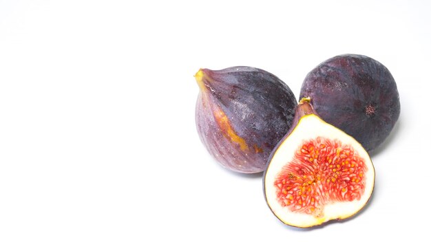 Ripe and juicy figs on a white background