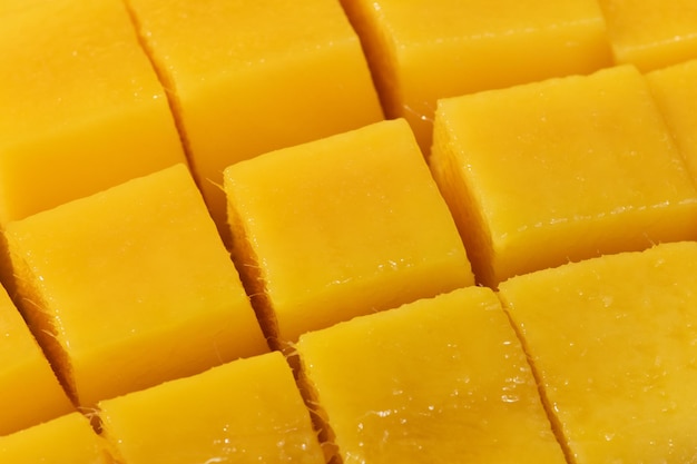 Ripe juicy mango sliced by cube pieces