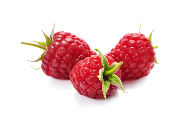 Ripe and juicy raspberries isolated on a white background in closeup