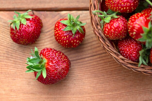 Ripe juicy strawberries on a wooden table Healthy food rich in fiber vitamins antioxidants Vegetarian food