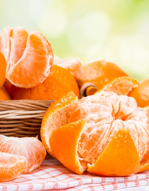 Ripe juicy tangerines in a wicker basket