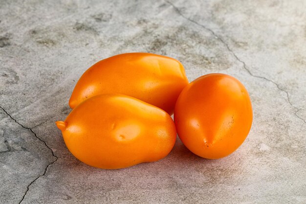 Ripe juicy yellow small tomato heap