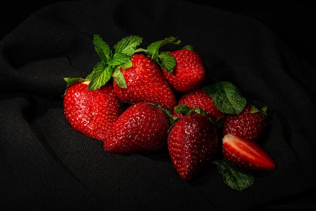 ripe large strawberries on a black background